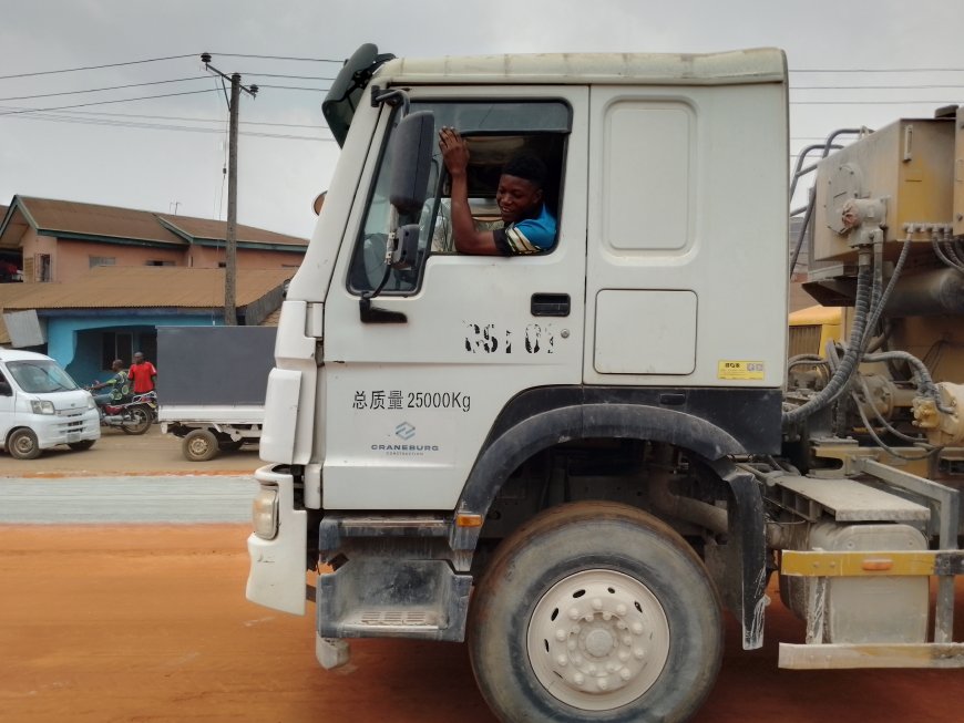 A Construction Worker Driving A Truck